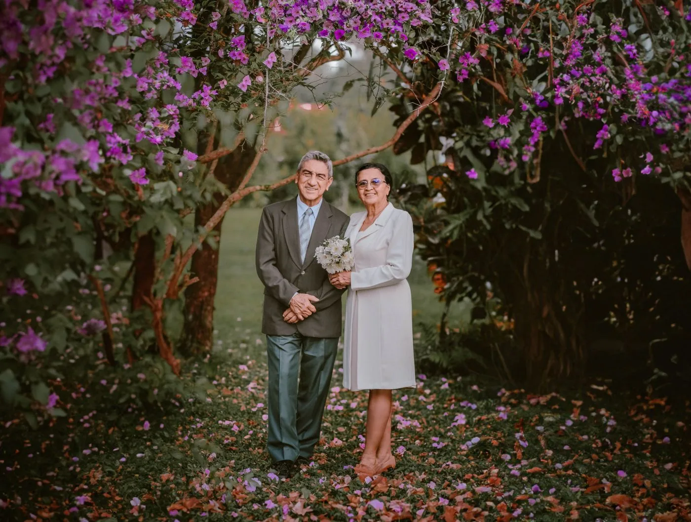 An older couple walking together through a garden on a relaxed first date